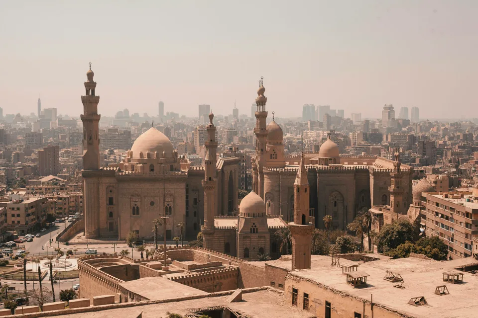 Historic mosque domes and minarets above the Cairo skyline