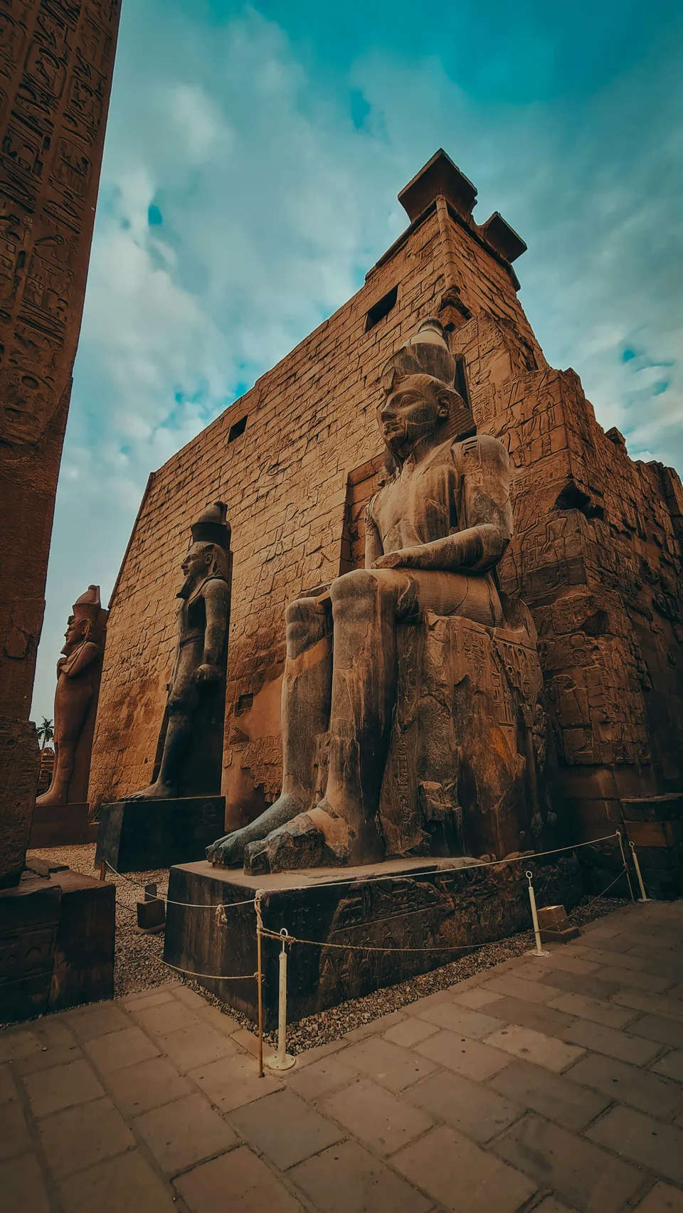 An ancient temple facade rising against a blue sky