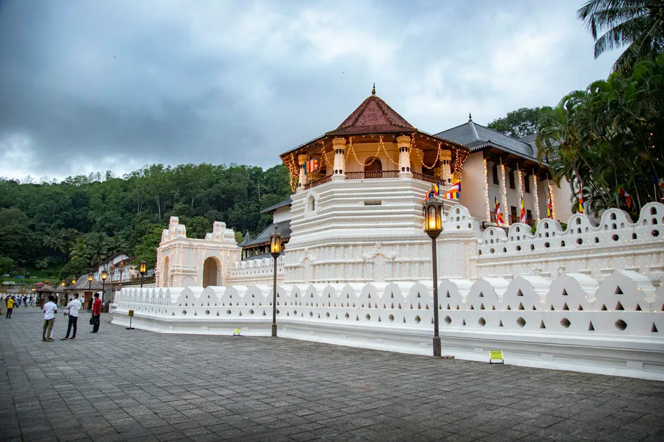 The white walls and ornate roof of the Temple of the Tooth in Kandy
