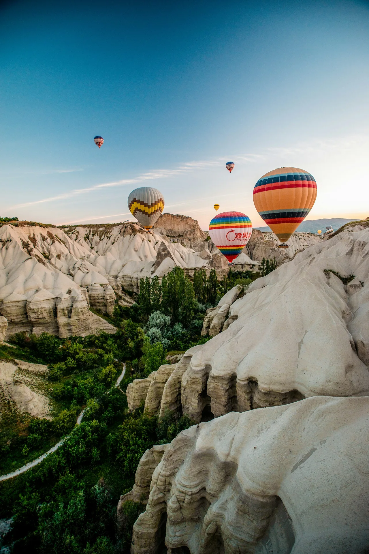 Balloons floating over the sculpted valleys of Cappadocia