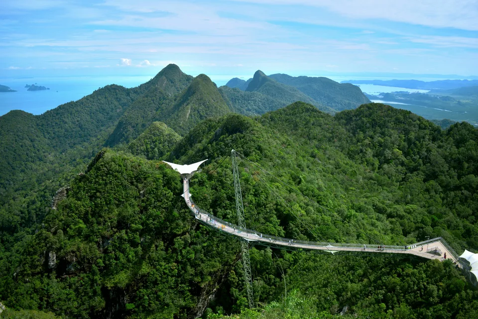 Langkawi Sky Bridge crossing forested peaks with the sea in the distance